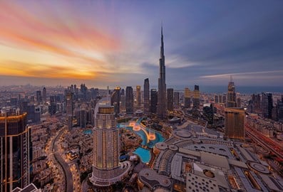 Stunning aerial sunset view of the Burj Khalifa and Downtown Dubai skyline.