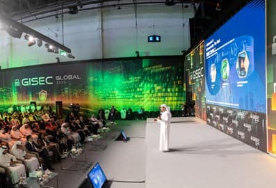 Audience attending a GISEC Global conference with a speaker on stage