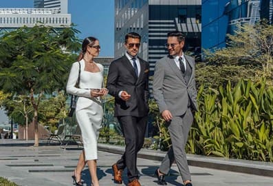 Business team discussing work in a landscaped outdoor area