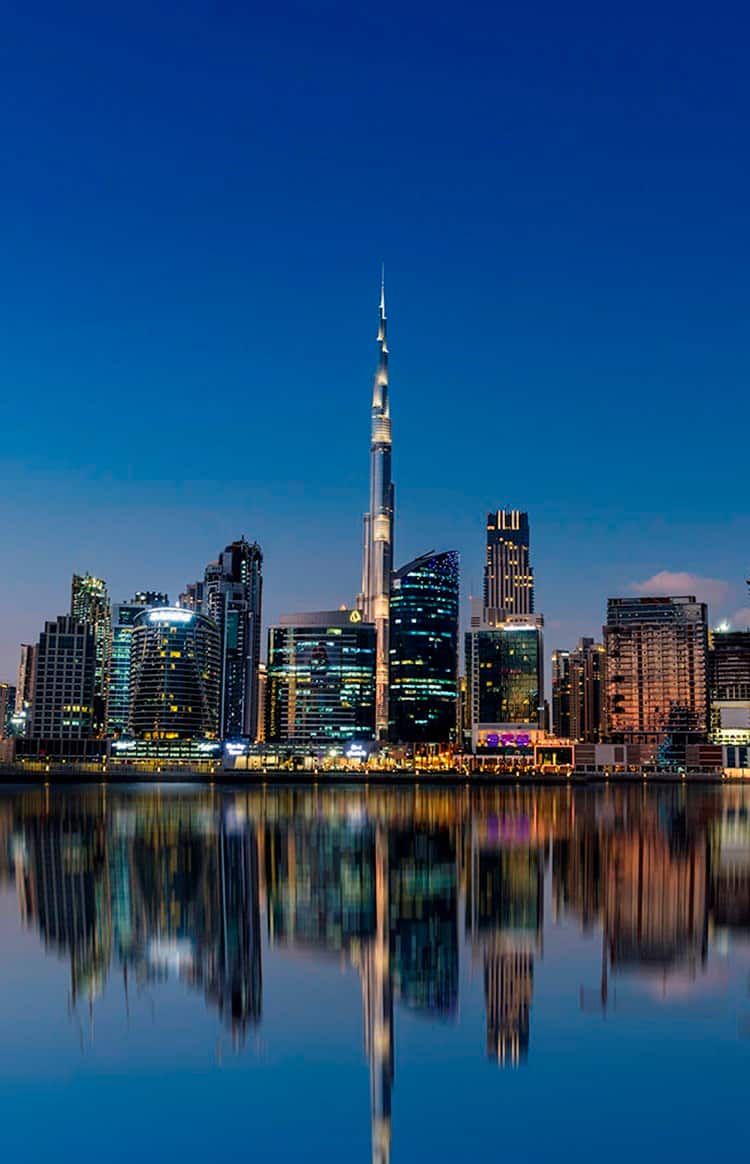 Dubai city skyline with the Burj Khalifa reflected in the waterfront
