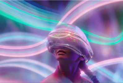 Person wearing a futuristic virtual reality headset surrounded by colourful light