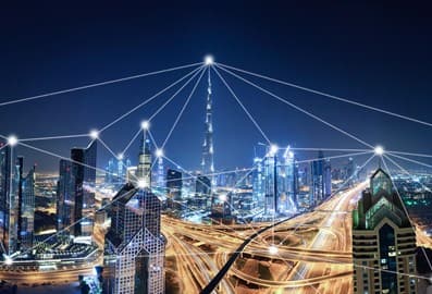 Dubai skyline with illuminated roads and digital connections across the city